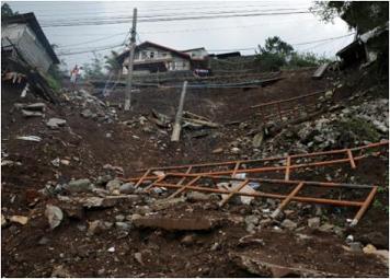 Photo 3: Landslide in a steep slope below a road (Crescencia Village)